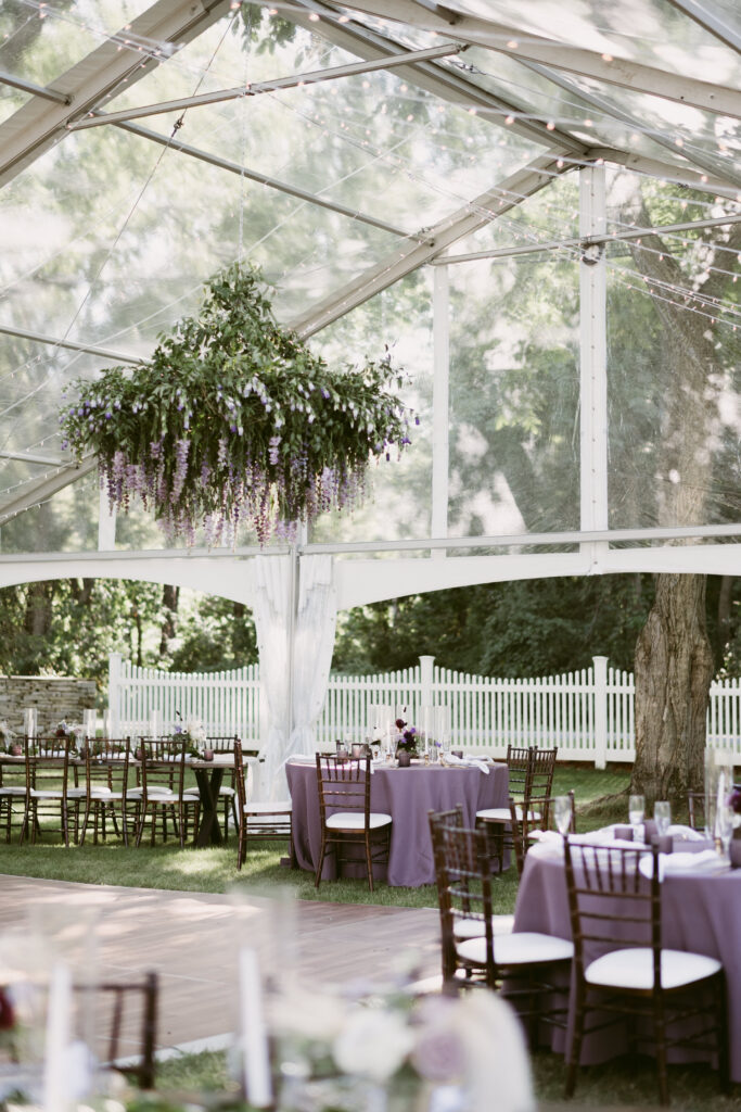 private estate lake wedding black swan floral design chandelier