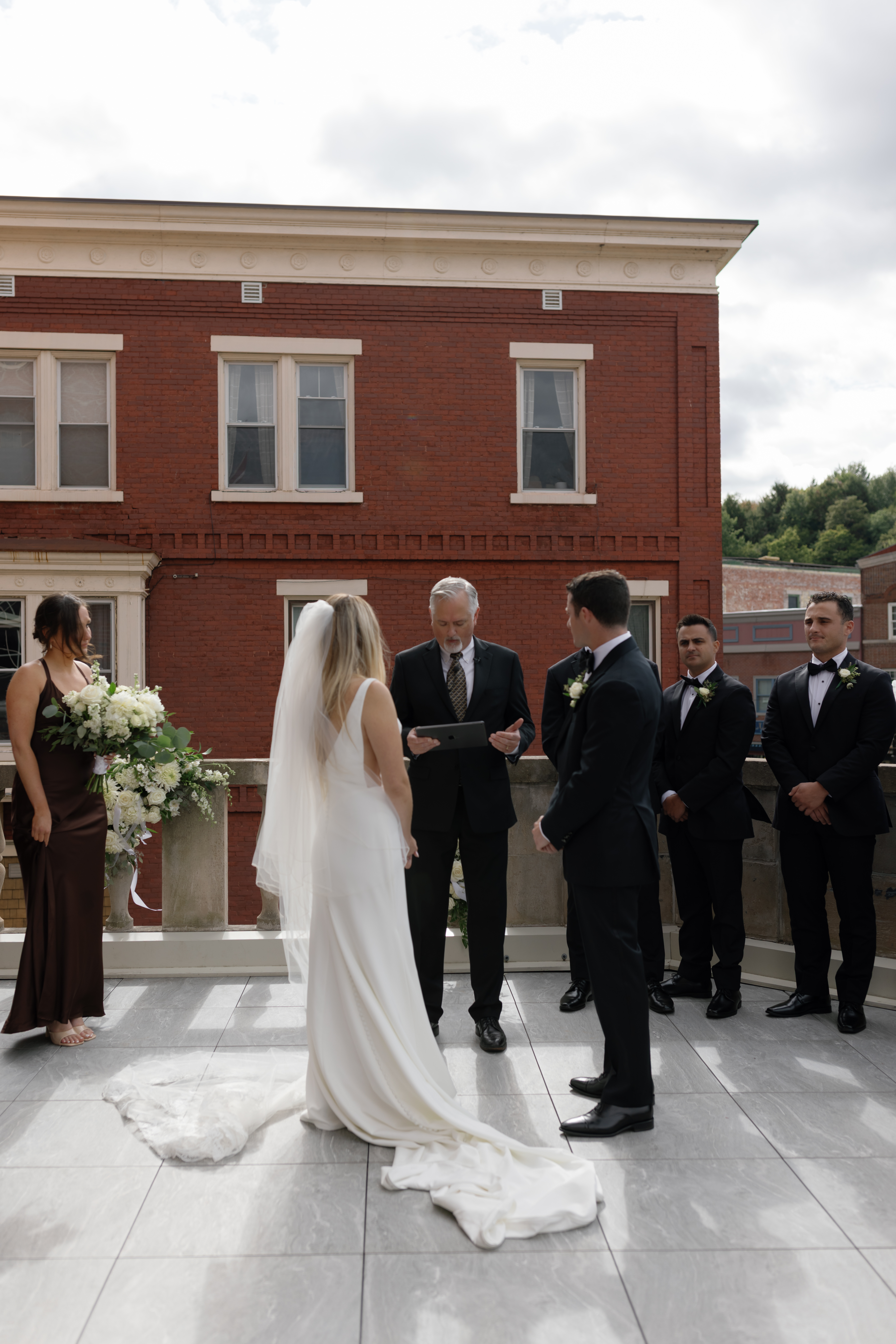 a couple exchanging rings during their wedding in Upstate NY