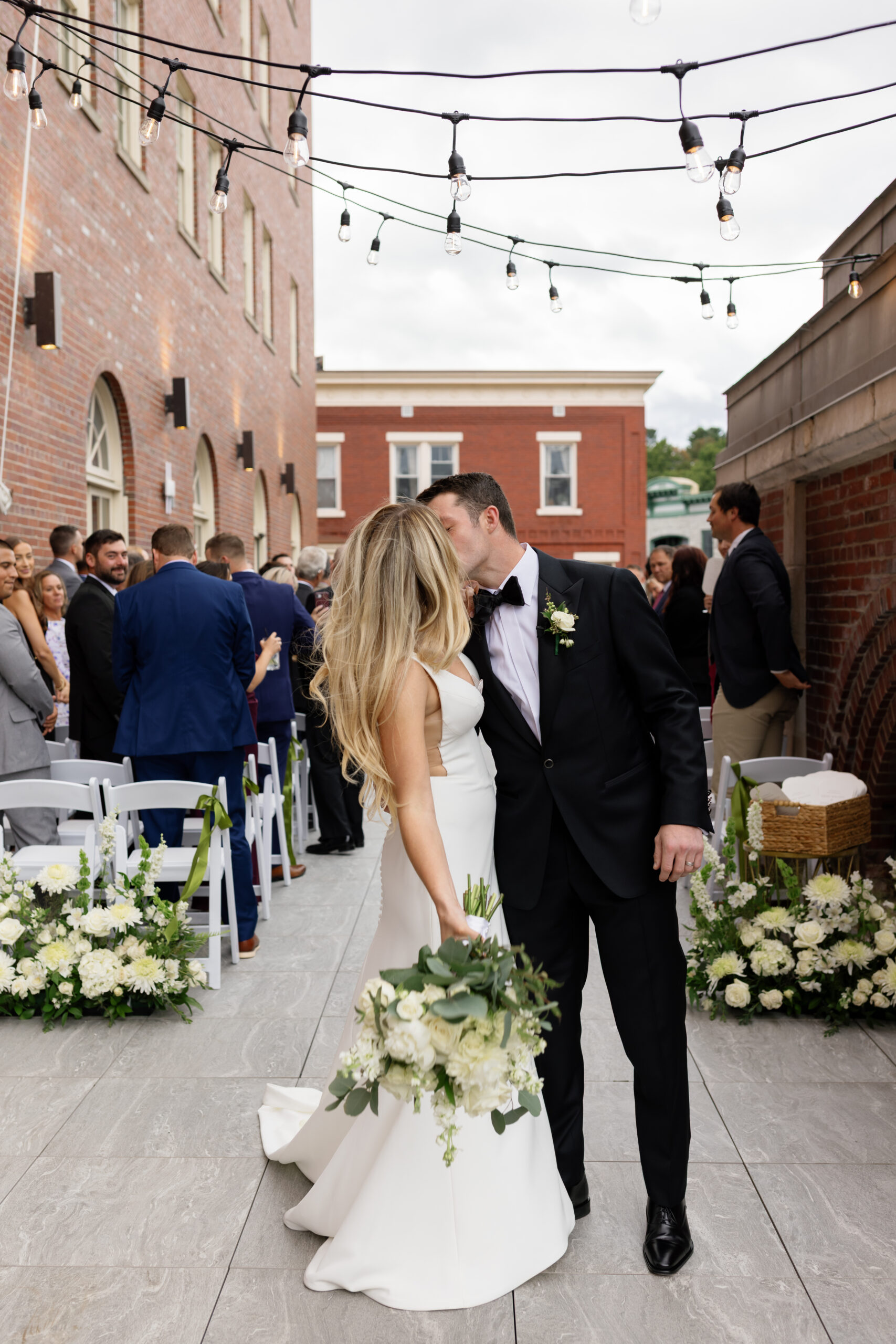 A couple kissing after getting married in NY