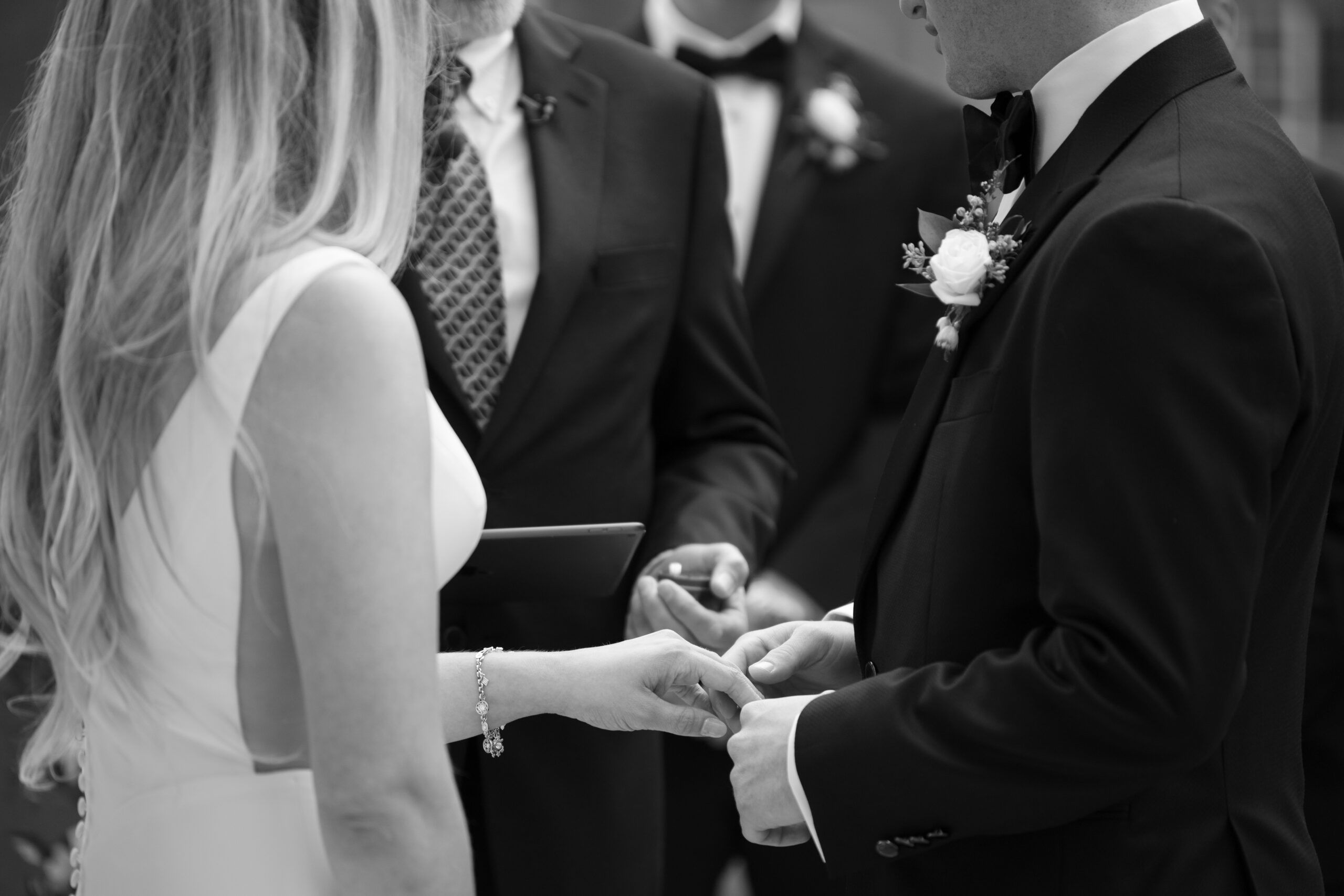 a couple exchanging rings during their wedding in Upstate NY